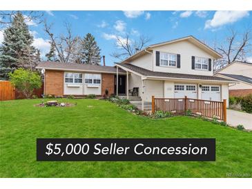 Charming two-story home with a well-manicured lawn, attached two-car garage, and inviting curb appeal at 1768 E Jamison Ave, Centennial, CO 80122