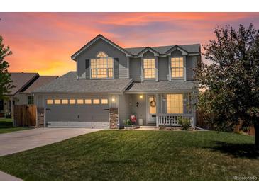 Charming two-story home with a well-manicured lawn and a two-car garage, perfect for families at 2006 E 97Th Ave, Thornton, CO 80229