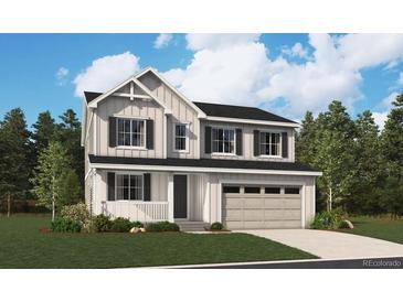 Charming two-story home with a modern farmhouse aesthetic, a two-car garage, and professional landscaping at 283 Wooten Ave, Brighton, CO 80601