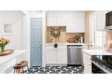 Bright kitchen featuring modern appliances, wooden accents, and stylish details, creating a functional and inviting space at 2313 S Race St # A, Denver, CO 80210