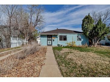 Charming single-story home featuring light blue siding and a well-maintained front yard, creating a cozy and inviting curb appeal at 1108 Roslyn St, Denver, CO 80220