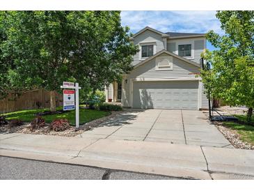 Charming two-story home with a well-maintained front yard and two-car garage at 22379 E Dorado Ave, Aurora, CO 80015