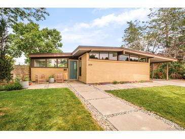 Attractive ranch-style home with unique architecture, manicured lawn, and charming curb appeal at 2849 E Cresthill Ave, Centennial, CO 80121