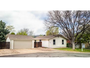 Charming single-story home with an attached garage and well-maintained front yard at 6338 W 92Nd Pl, Westminster, CO 80031