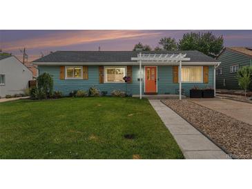 Charming single-story home featuring a well-maintained lawn and an inviting orange front door at 1892 S Meade St, Denver, CO 80219