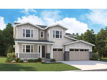 Charming two-story home featuring a welcoming porch and a convenient two-car garage at 5518 Tamarack Ave, Firestone, CO 80504