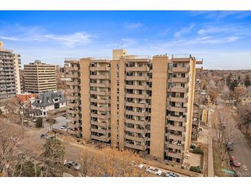 Multi-story building with balconies on each level offers stunning city views, ideal for urban living at 700 N Washington St, Denver, CO 80203