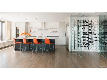 Modern kitchen with marble island, wine storage, and high-end appliances at 1133 14Th St # 2720, Denver, CO 80202