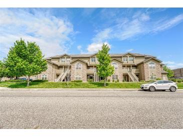 Multi-Gathering condominium with stone accents, exterior stairs, and well-maintained landscaping at 3261 S Waco Ct # C, Aurora, CO 80013