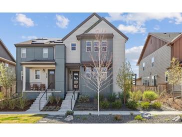 Charming two-story home with well-maintained landscaping and welcoming front entrance at 6364 Fulton St, Denver, CO 80238