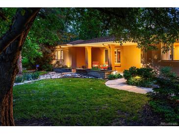 Charming home exterior features a landscaped yard, inviting entrance, and warm lighting at 250 S Dahlia St, Denver, CO 80246