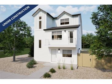 New construction two-story home featuring white siding, a small porch, and a xeriscaped front yard at 46537 Avery Ln, Bennett, CO 80102