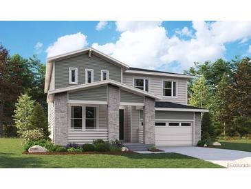 Stunning two-story home with modern design, attached garage and professionally landscaped front yard at 2680 Simpson Ln, Erie, CO 80026