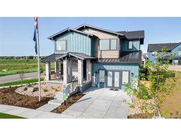 Attractive two-story home with stylish exterior, inviting front porch, and well-manicured landscaping at 5567 Moosehead Cir, Longmont, CO 80503