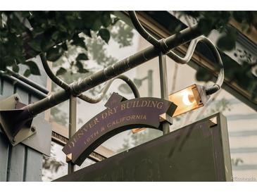 Close up of the Denver Dry Building sign, featuring a vintage design and architectural details at 1555 California St # 609, Denver, CO 80202