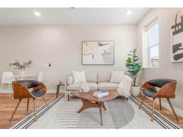 Inviting living room featuring modern furnishings, stylish decor, and natural light, perfect for relaxation and entertaining at 1071 Oak Cir, Lakewood, CO 80215