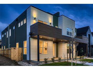 Modern two-story home boasting a sleek design and professional landscaping at 2466 S Cherokee St, Denver, CO 80223