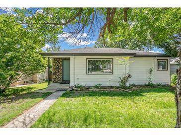 Charming single-story home with a well-maintained front yard and stone accents at 5008 Alcott St, Denver, CO 80221