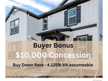 Beautiful home featuring white siding, black trim, and well-kept landscaping with special buyer concessions at 8358 Howell St # B, Arvada, CO 80005