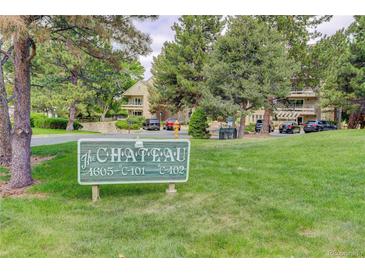 The Chateau community sign in front of lush landscaping and residential buildings at 4605 S Yosemite St # 301, Denver, CO 80237