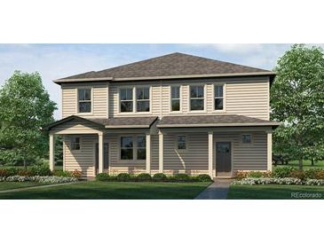 Charming two-story home with mature trees, manicured landscaping, and welcoming front porch at 1396 S Boston Ct # A, Denver, CO 80247