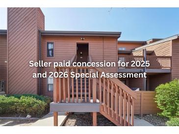 Two-story condo featuring a private entrance and stairway leading to the upper level at 540 S Forest St # 3-204, Denver, CO 80246