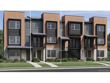 Modern townhome with a well-maintained lawn and a stylish combination of neutral and black exterior accents at 825 Josephine Way, Superior, CO 80027