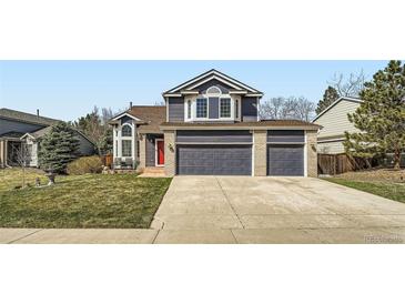 Charming home with a well-manicured lawn, and a three-car garage at 16442 Bluebonnet Dr, Parker, CO 80134