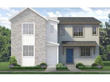 Charming two-story home featuring stone and siding, complemented by a well-manicured lawn and bright blue door at 1444 Coral Pl, Longmont, CO 80501