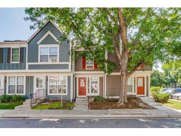 Charming townhomes with colorful facades and well-maintained landscaping in a desirable neighborhood at 1068 Milo Cir # A, Lafayette, CO 80026