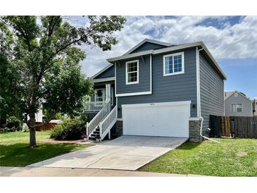 Charming two-story home features a well-manicured lawn, a two-car garage, and a front porch with lovely curb appeal at 4178 E 94Th Pl, Thornton, CO 80229