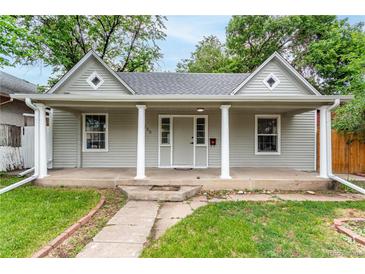 Charming single-story home featuring a covered front porch with column supports and well-maintained landscaping at 725 Knox Ct, Denver, CO 80204