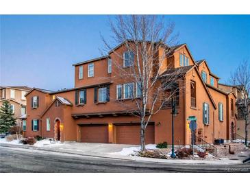 Beautiful three-story home with three-car garage and mature trees at 3851 Stonebrush Dr # 11B, Littleton, CO 80126