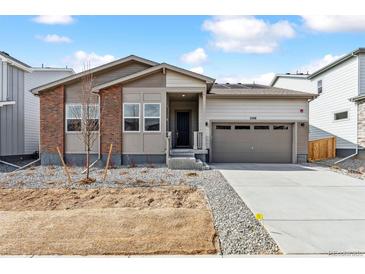 Charming single-Gathering home with brick accents, two-car garage, and a freshly landscaped front yard at 2548 Wesley Ln, Lafayette, CO 80026
