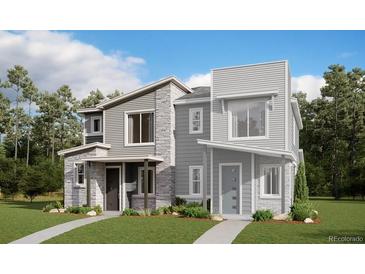 Modern two-story townhome with stone and siding accents at 22841 E Stanford Ln # B, Aurora, CO 80015