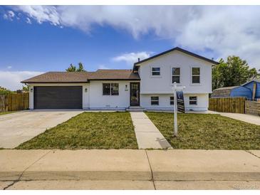 Charming two-story home with a well-maintained front yard, driveway, and inviting curb appeal at 2830 E 99Th Way, Thornton, CO 80229