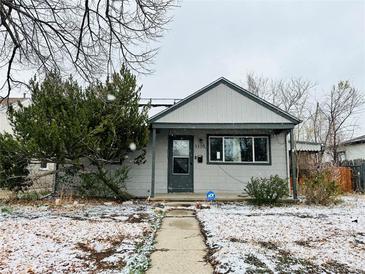Charming single Gathering home with gray siding, landscaped front yard, and inviting walkway at 1170 Elmira St, Aurora, CO 80010