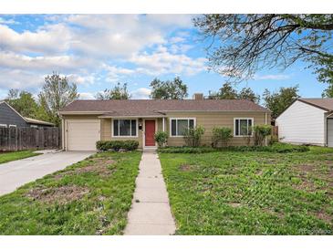 Charming single-story home featuring a well-manicured lawn and a welcoming red front door at 4906 E Bates Ave, Denver, CO 80222