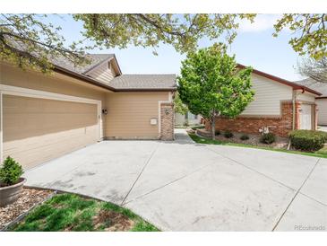 Charming home featuring a spacious driveway and well-maintained landscaping at 6193 Terry Ct, Arvada, CO 80403