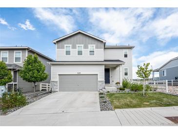 Charming two-story home with a well-maintained lawn, a two car garage, and neutral color palette at 3699 Makley Cir, Castle Rock, CO 80104