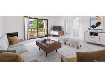 Bright living room featuring a balcony, contemporary furniture, and neutral tones at 660 S Alton Way # 3B, Denver, CO 80247