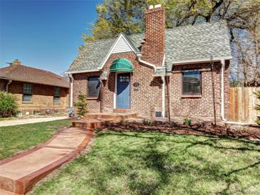 Charming brick home with a well-maintained lawn and inviting entryway, creating a warm curb appeal at 1378 Forest St, Denver, CO 80220