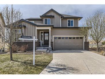 Beautiful two-story home with a well-manicured lawn and attached two car garage at 12291 Coral Burst Ct, Parker, CO 80134
