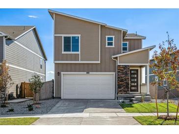 Two-story modern home with attached garage and landscaped front yard at 17919 Dandy Brush Dr, Parker, CO 80134