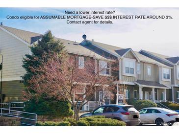 Condo exterior showing multiple units and landscaping at 14700 E 104Th Ave # 2605, Commerce City, CO 80022