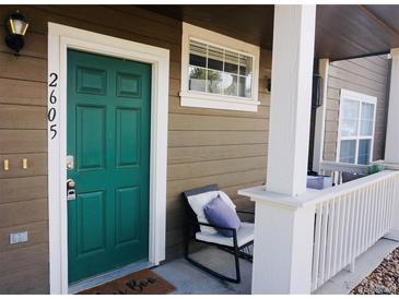 Charming front door with a welcoming exterior and seating area at 14700 E 104Th Ave # 2605, Commerce City, CO 80022