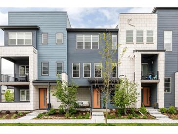 Charming townhomes with modern exteriors, bright doors, and well-maintained landscaping create curb appeal at 6307 Dayton Ct, Denver, CO 80238