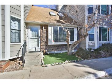 Charming townhome with brick facade, concrete steps, and drought-tolerant landscaping at 7978 Chase Cir # G, Arvada, CO 80003