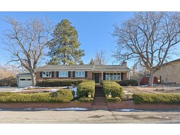 Brick ranch home with landscaped yard and mountain views at 56 Hillside Dr, Wheat Ridge, CO 80215