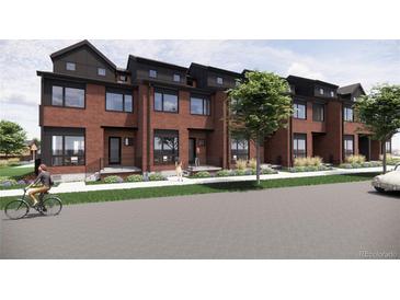 Beautiful red brick townhomes featuring black trim, large windows, and modern architectural details at 1170 Violet Ave, Boulder, CO 80304